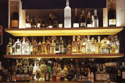Shelves of drinks in the mobile bar in an event catered by Bar Cartel.