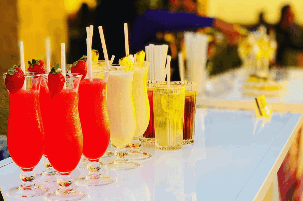 Cocktails and a variety of beverage mixed and served by the Cosmic Cocktails mobile bar in an event.