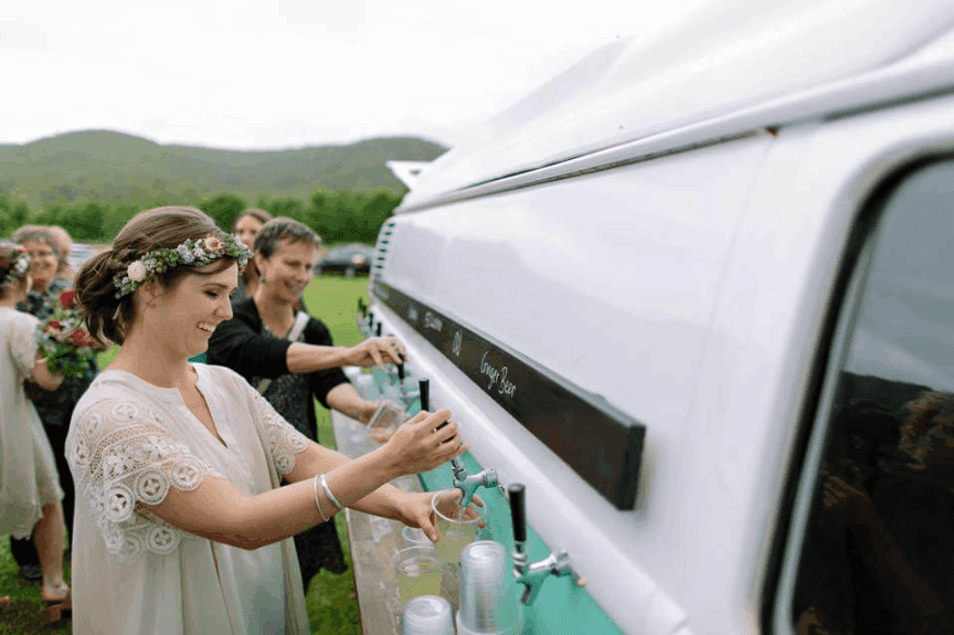 Guest of an event serviced by the Kombi Keg getting drinks from the mobile bar.