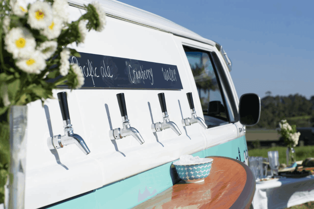 Four beverage taps of the Kombi Keg Townsville's mobile bar with variety of drinks.