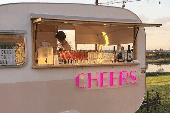 Skilled staffs inside the mobile bar ready to serve the event.