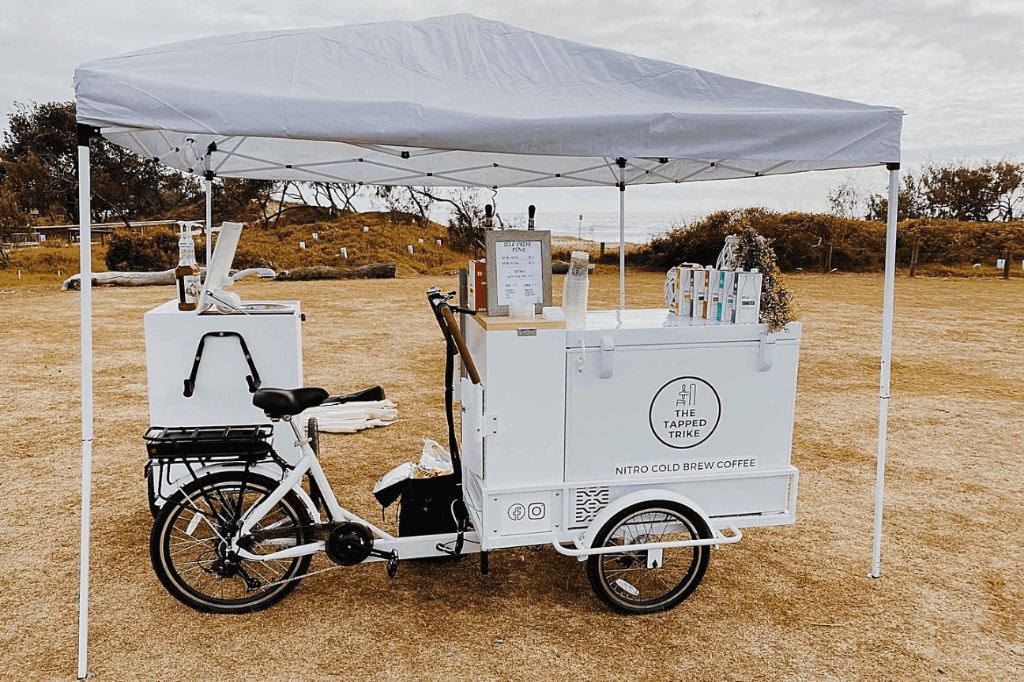 The mobile bar of Tapped Trike catering an event in Queensland.