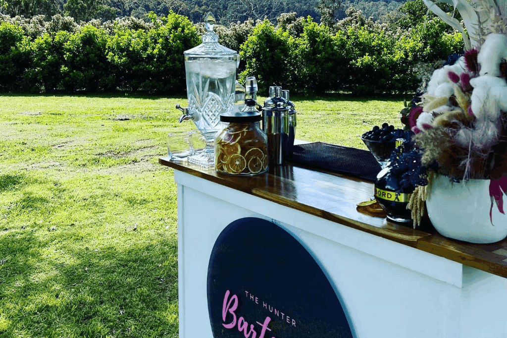 The Hunter Bartenders mobile bar serving in an event.