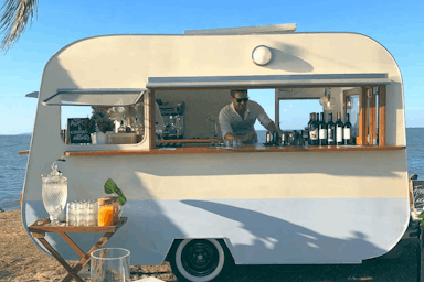Port Douglas' mobile bar is outfitted with employees and tools to serve during an event.